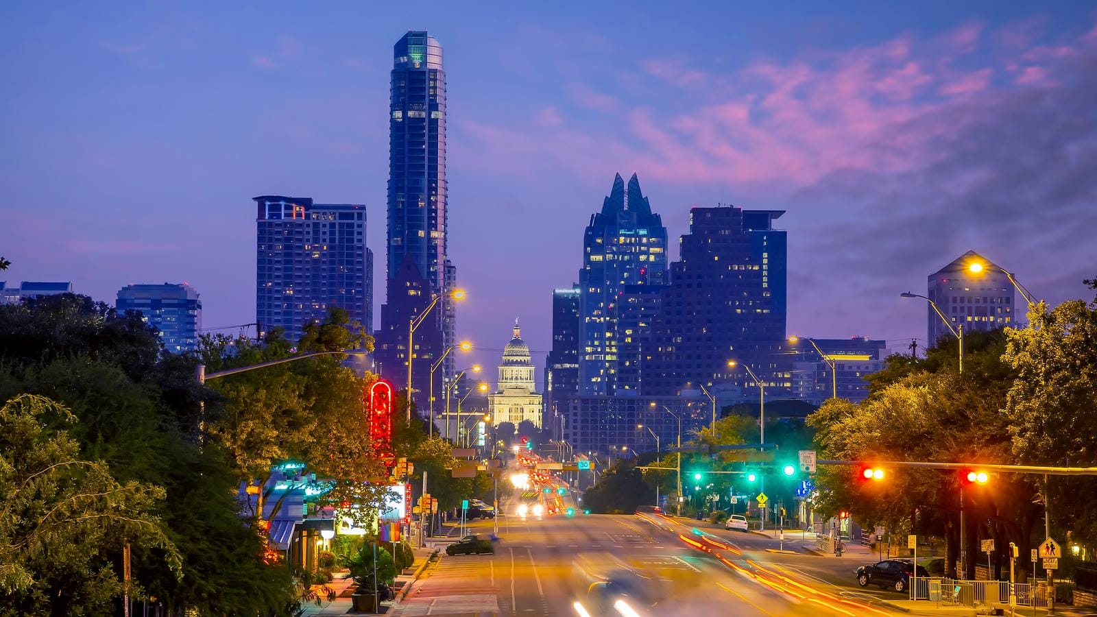 a view of a austin city street at night.